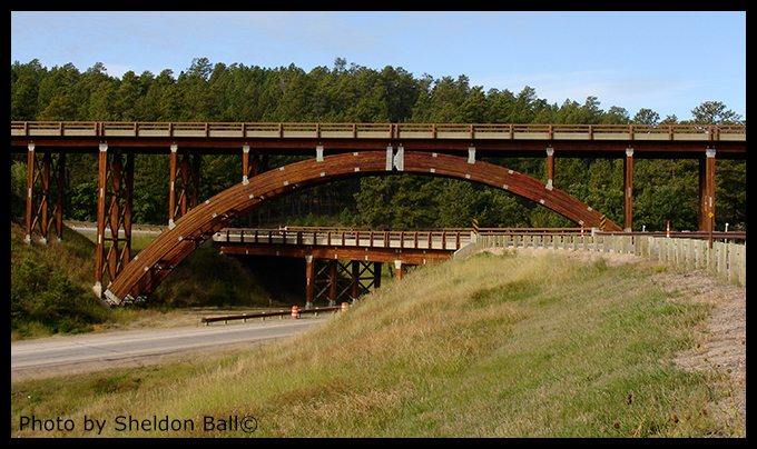 photo of wooden bridge on the road to Mount Rushmore in South Dakota - Photo by Sheldon Ball